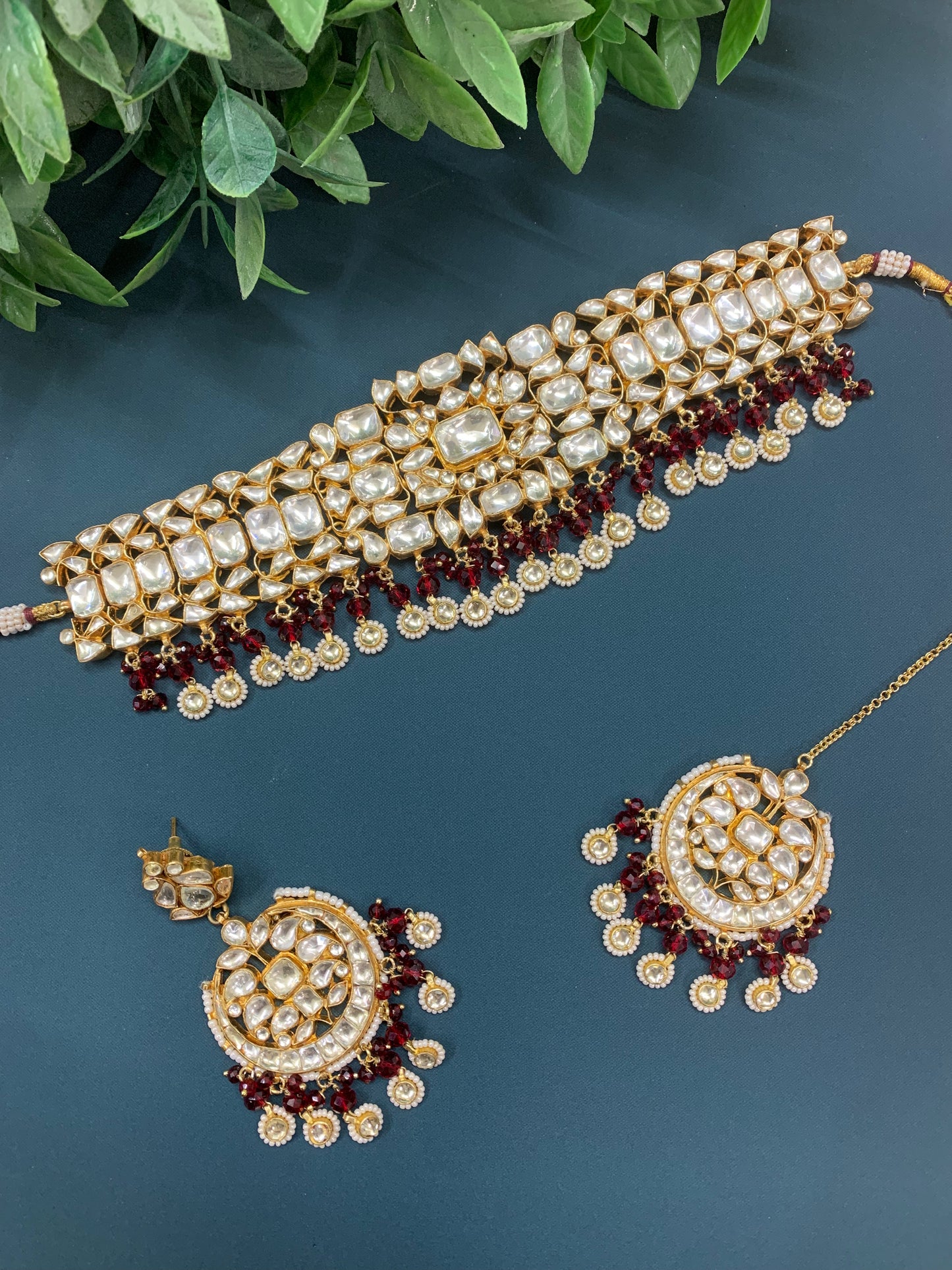 Farin pachi kundan choker set in maroon red