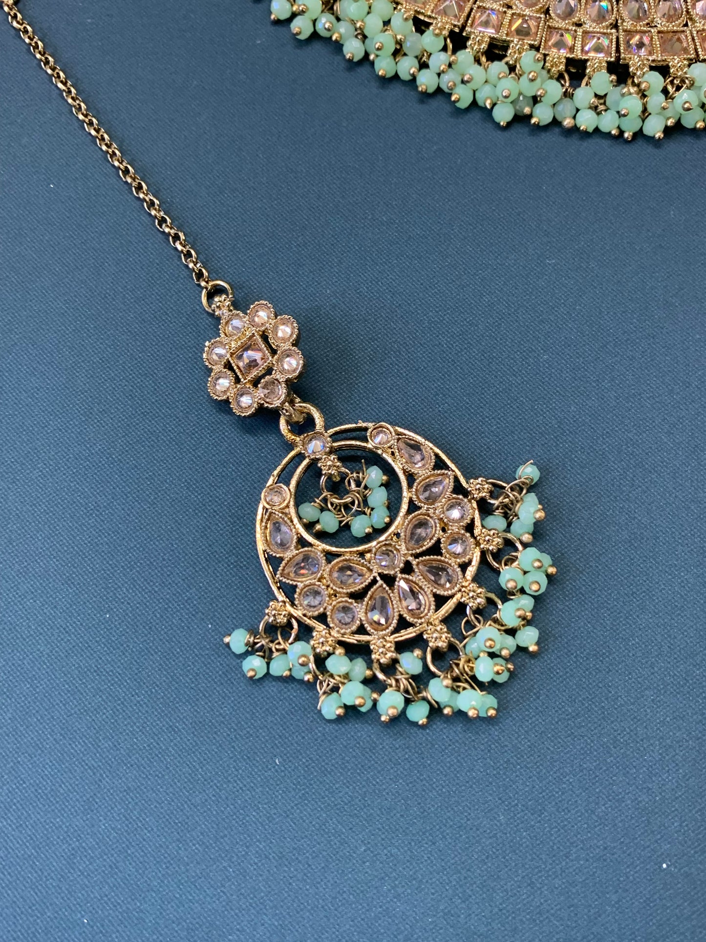 Rashmeet polki necklace with matching earring tikka antique gold mint green