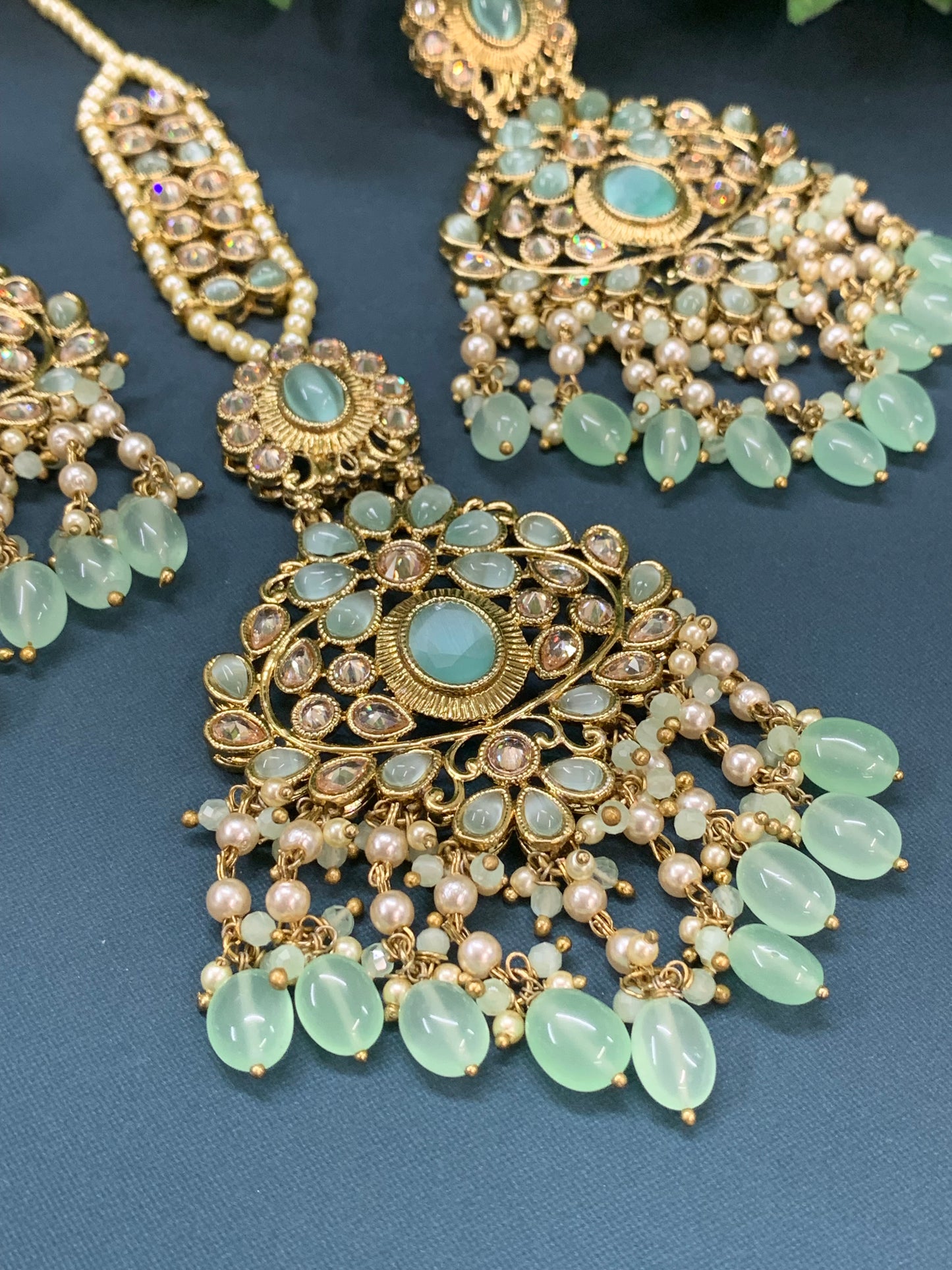 Ravi reverse polki earring tikka set with pearl and pistachio green glass drop