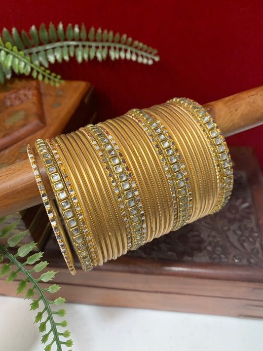 Gold churi and kundan bangle