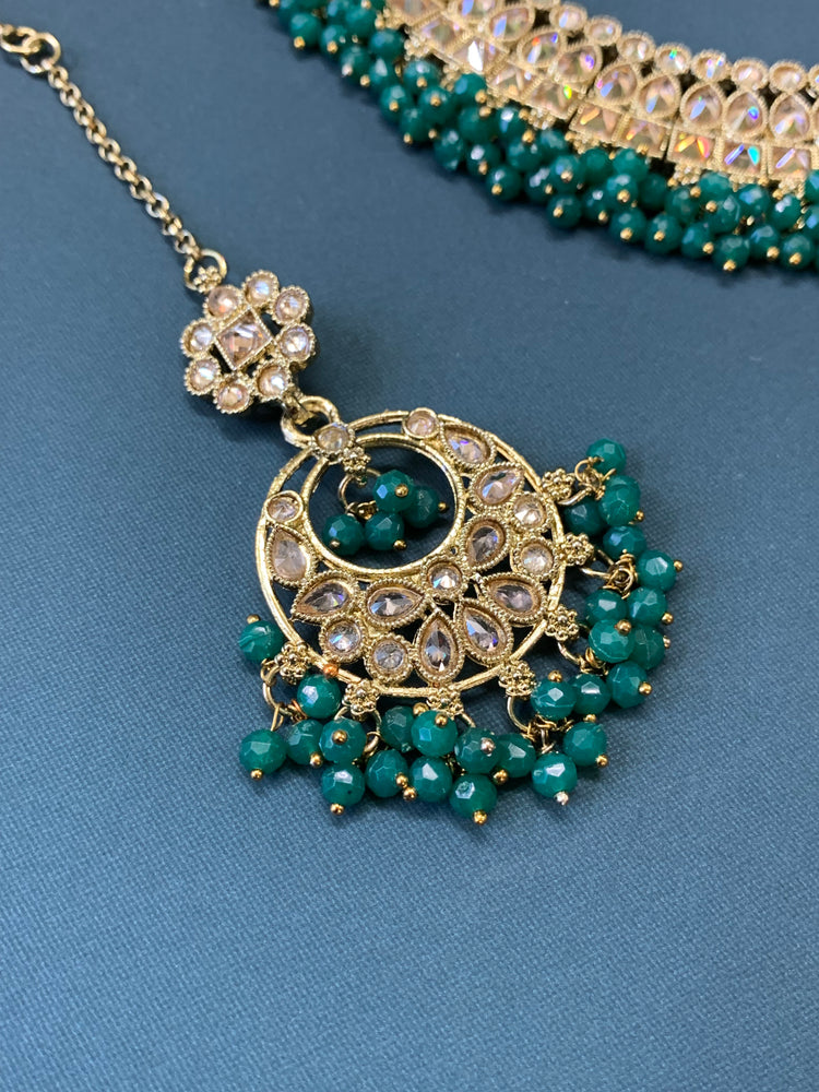 Rashmeet polki necklace with matching earring tikka antique gold emerald green