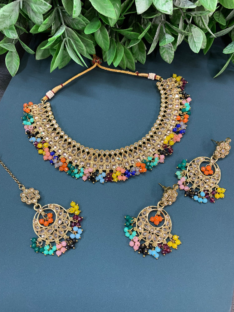 Rashmeet polki necklace with matching earring tikka multi