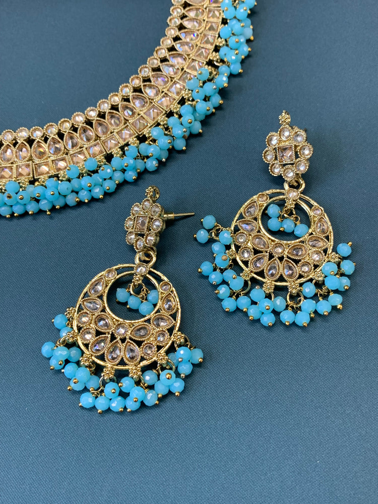 Rashmeet polki necklace with matching earring tikka antique gold baby blue