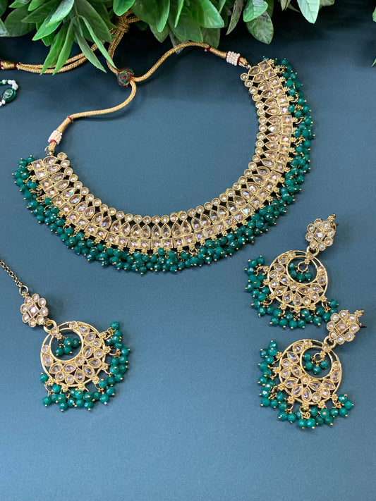 Rashmeet polki necklace with matching earring tikka antique gold emerald green