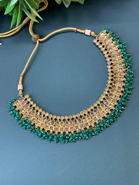 Rashmeet polki necklace with matching earring tikka antique gold emerald green