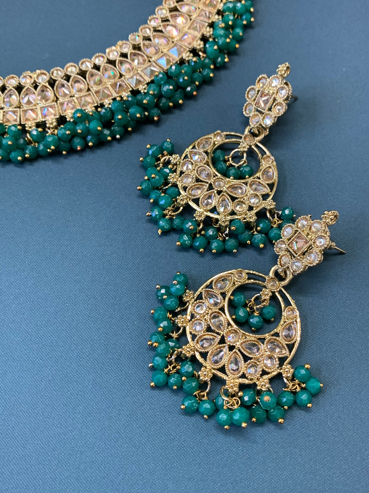 Rashmeet polki necklace with matching earring tikka antique gold emerald green