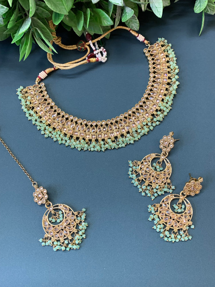 Rashmeet polki necklace with matching earring tikka antique gold mint green