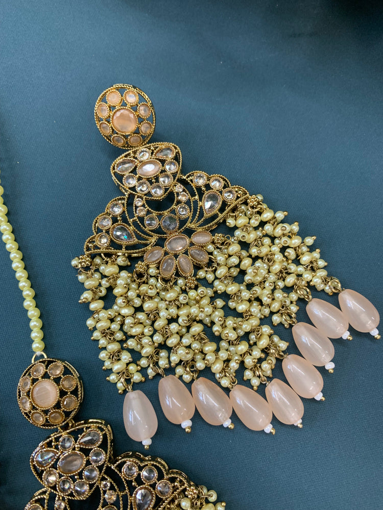 Cara statement polki earring tikka set pearl details and nude peach