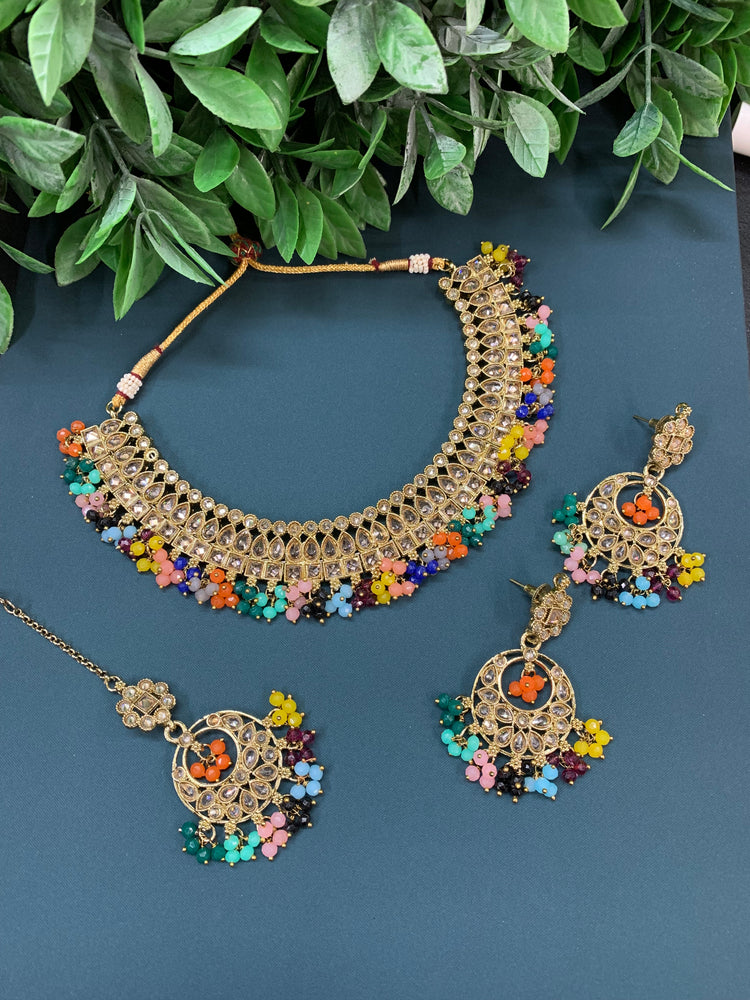 Rashmeet polki necklace with matching earring tikka multi