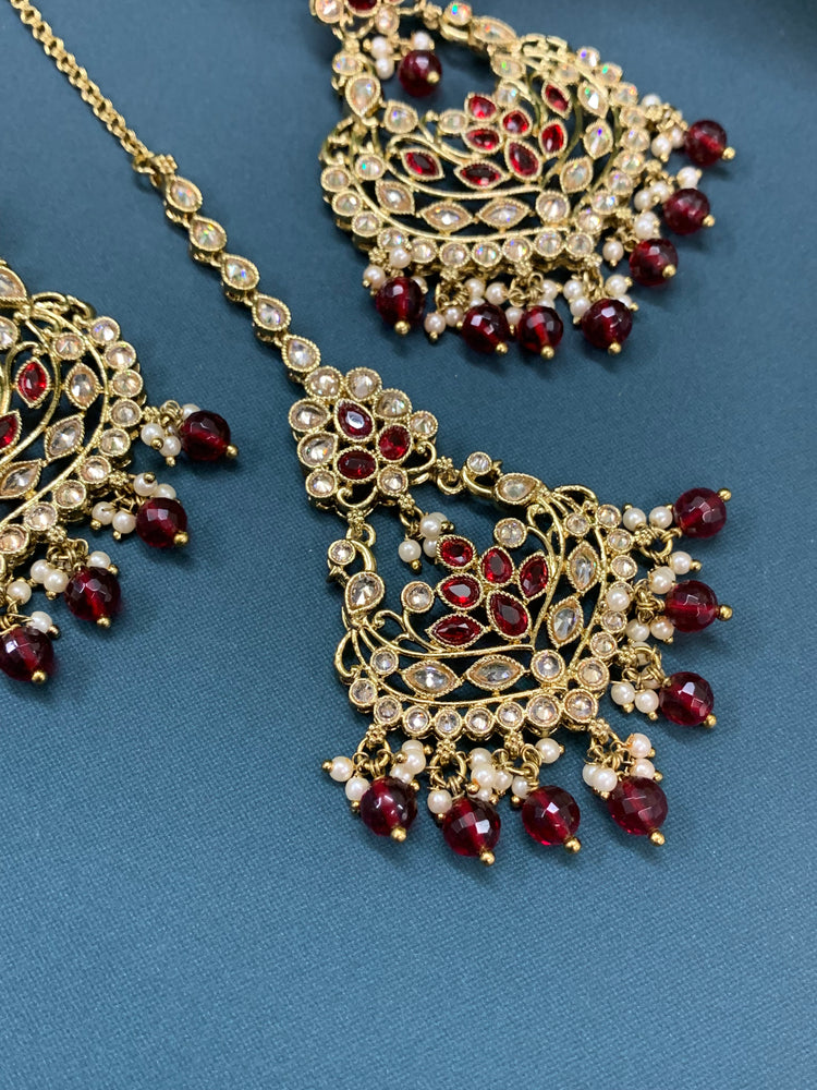 Raina reverse polki earring tikka set with pearl and maroon glass drop