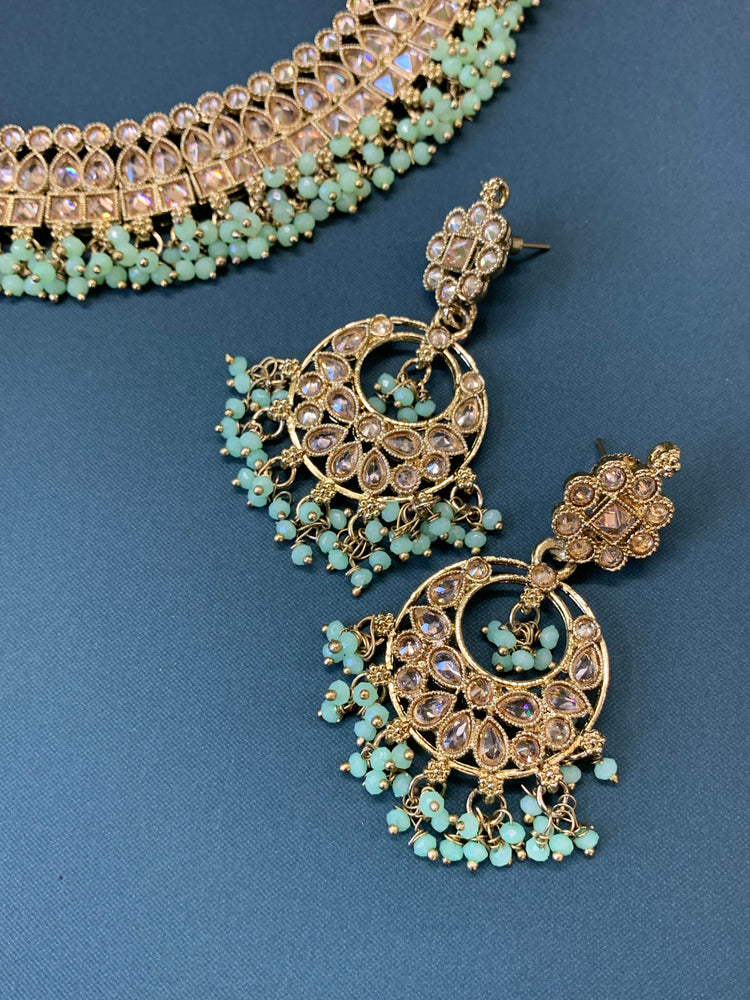 Rashmeet polki necklace with matching earring tikka antique gold mint green