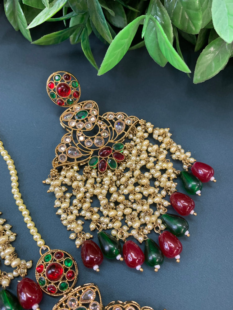 Cara statement polki earring tikka set pearl details and red green multi