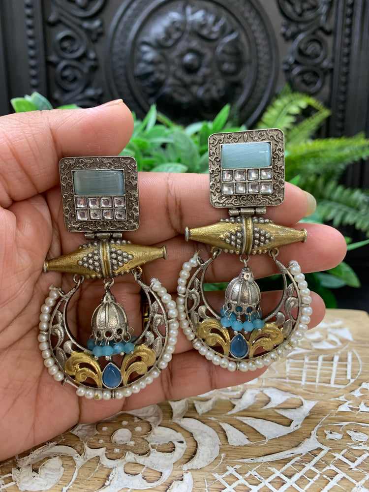 Taha dual tone chandbali style German silver earring light blue