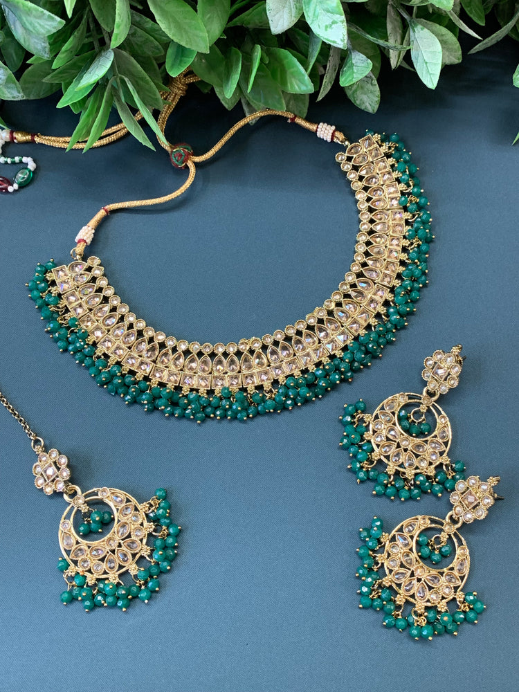 Rashmeet polki necklace with matching earring tikka antique gold emerald green