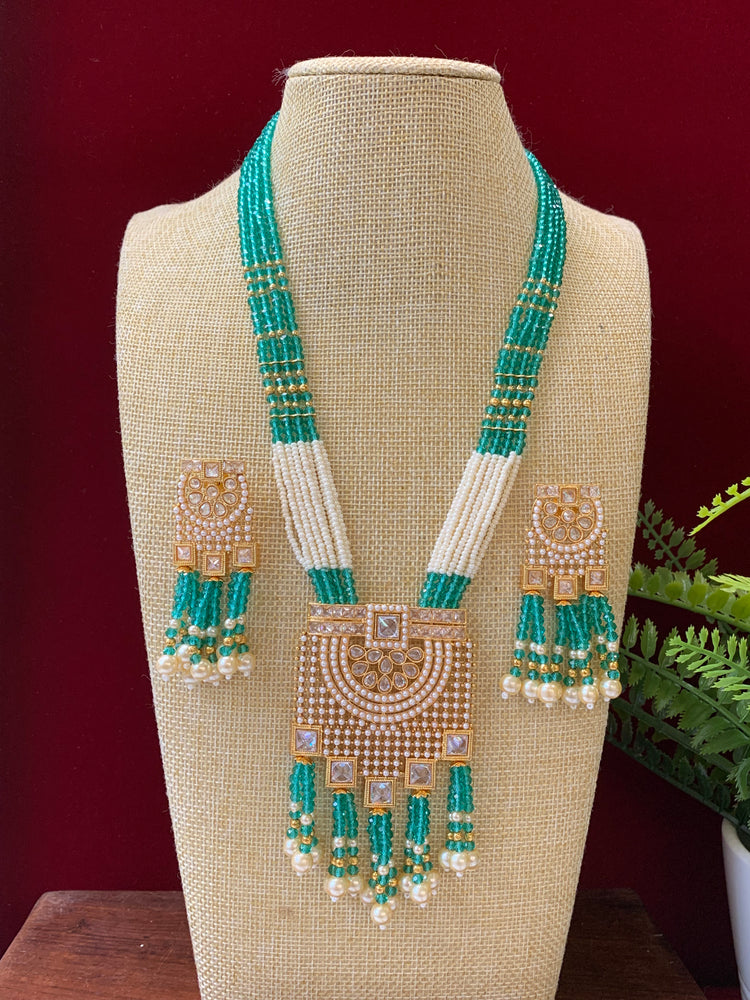 Anika polki long mala set gold polki and teal blue