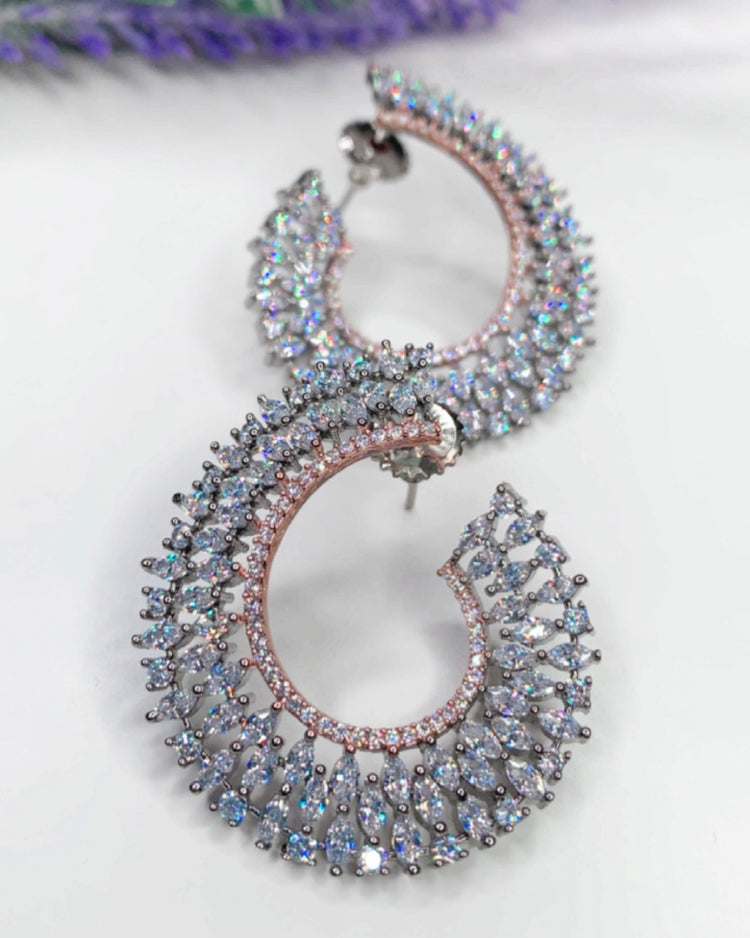 “Twisted love” American diamond hoop earring