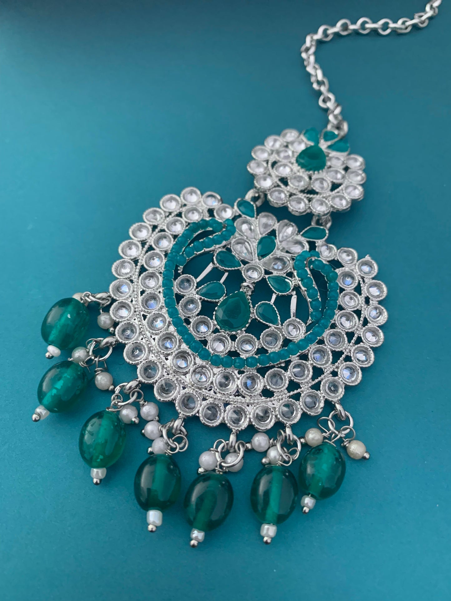 Single medium to big tikka in teal / silver